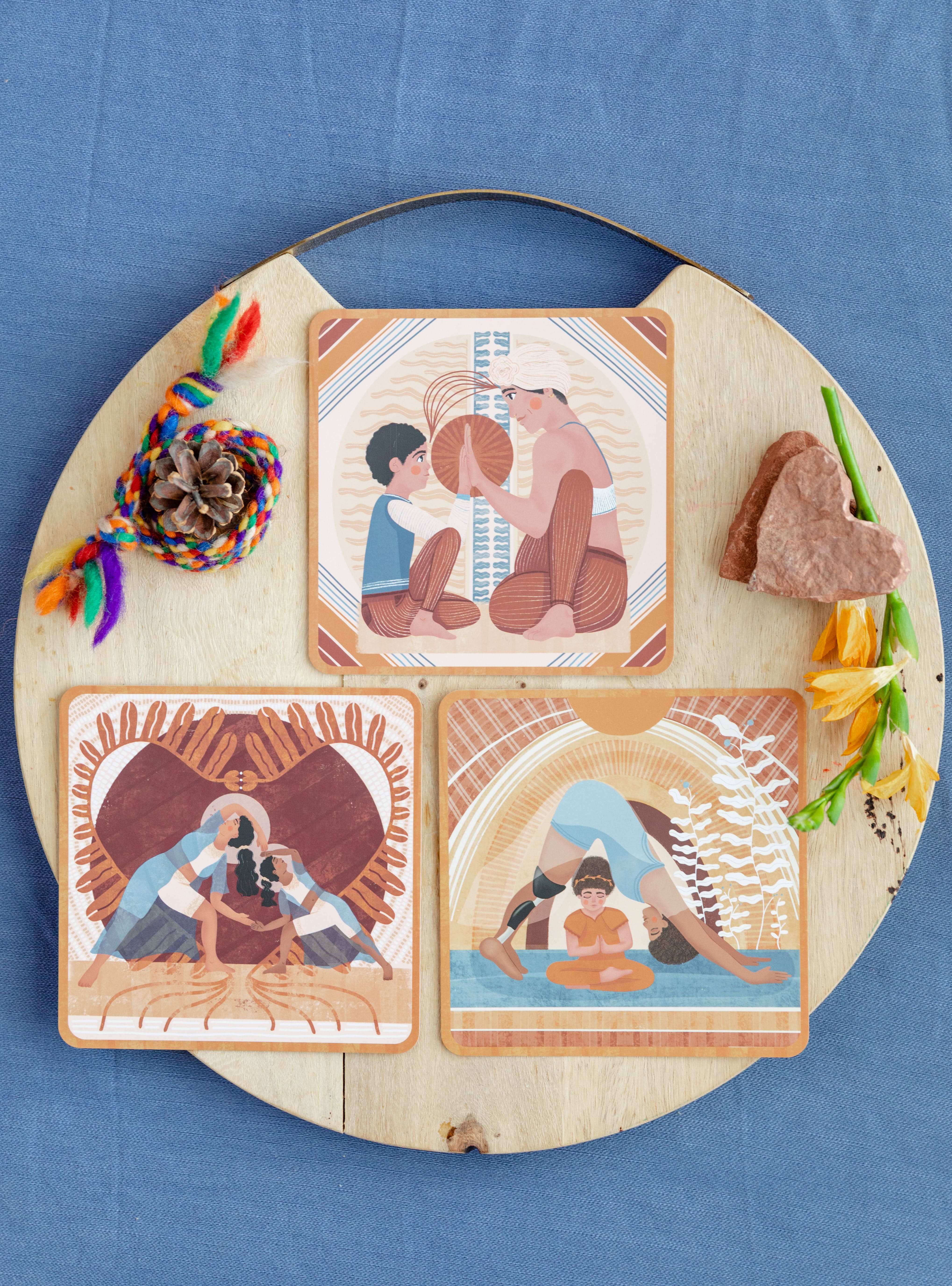 a series of partner yoga cards featuring parents and children doing the yoga postures together. this set shows three different yoga poses with people of a variety of ethnicities and physical abilities. 